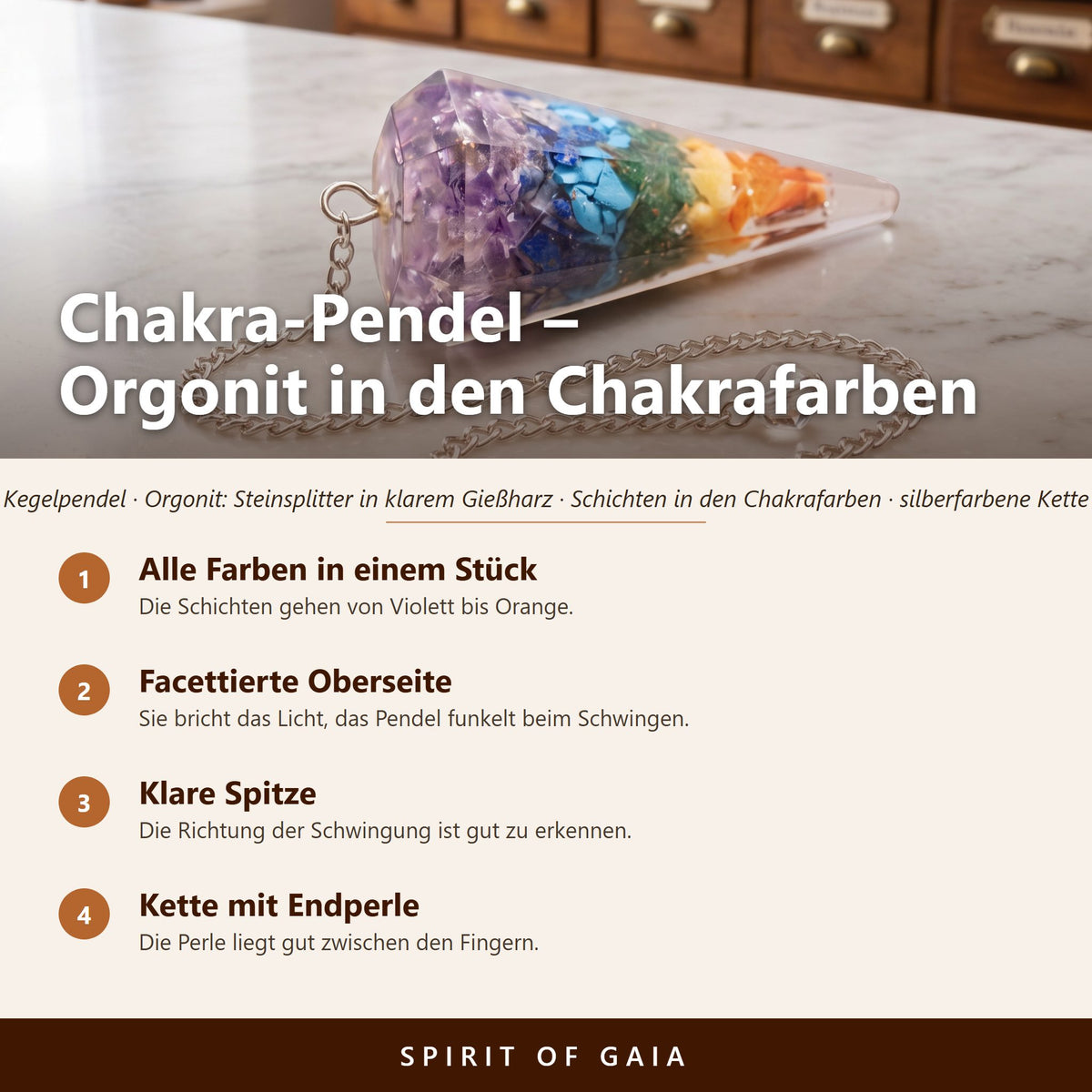 Übersicht zum Chakra-Pendel aus Orgonit: alle Farben in einem Stück, facettierte Oberseite, klare Spitze, Kette mit Endperle